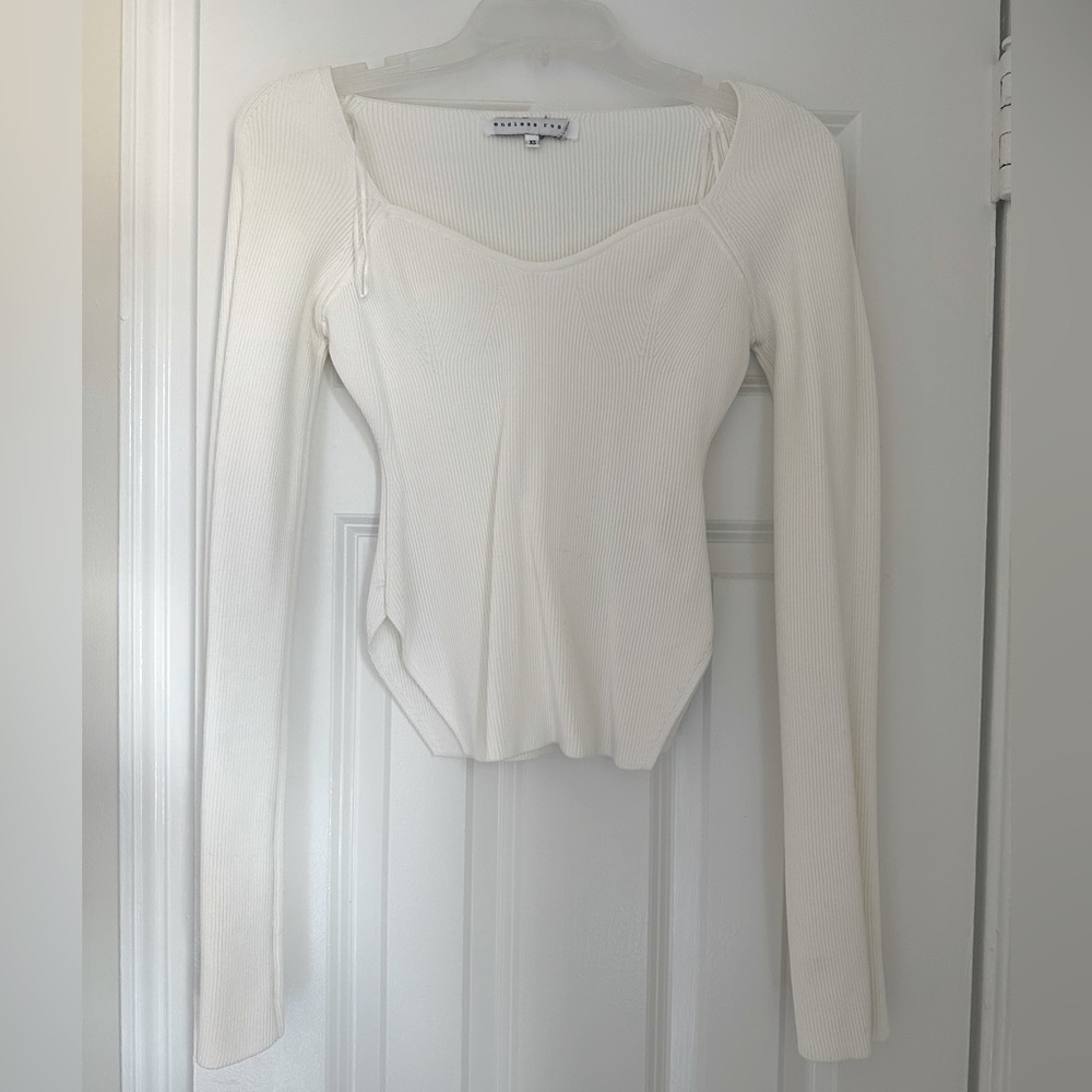 White fitted white long sleeve shirt